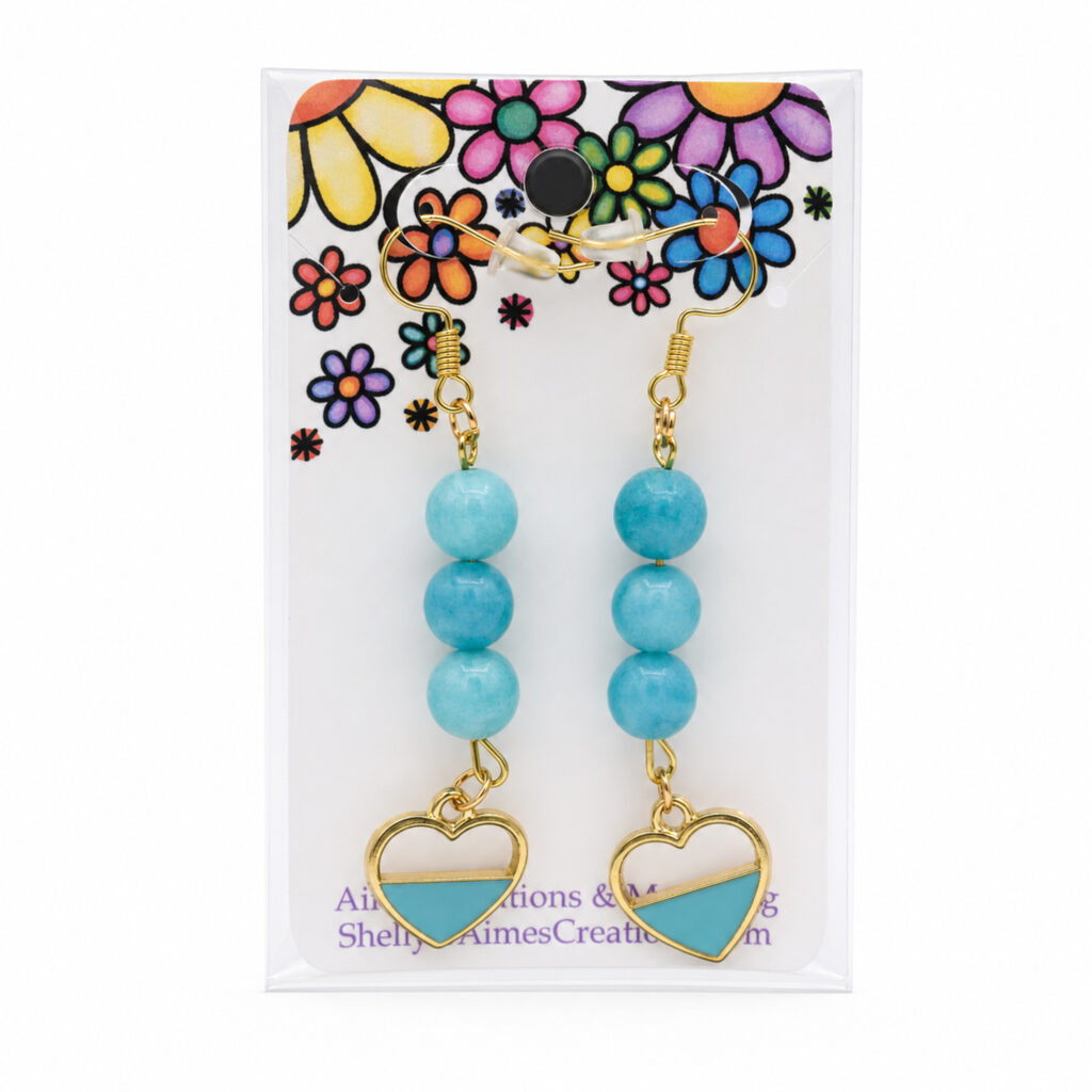 Pair of turquoise blue beaded dangle earrings with gold-tone heart charms